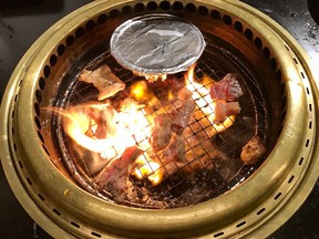 The aluminum tin contains clams in sake at Gyubee, the Japanese grill restaurant in the ByWard Market.