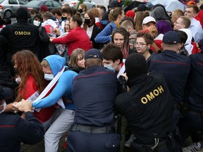 Law enforcement officers detain students during a protest against presidential election results in Minsk, Belarus on Sept. 1, 2020.