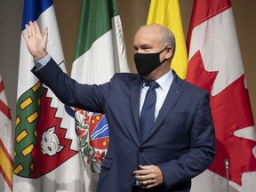 File photo/ Conservative Leader Erin O'Toole waves to members of the National Caucus as he is applauded at the start of the meeting in Ottawa, Wednesday, September 9, 2020.