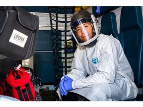 The new Powered Air Purifying Respirators (PAPRs) feature a face  mask affixed to a helmet with an air hose leading to a filtration unit on the paramedic's belt.