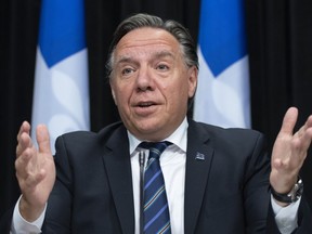 Quebec Premier Francois Legault responds to reporters questions during a news conference on the COVID-19 pandemic at the National Assembly in Quebec City, Tuesday, Sept. 15, 2020. The Quebec government is planning a more impactful advertising campaign to unconvinced Quebecers that COVID-19 is a serious health issue.