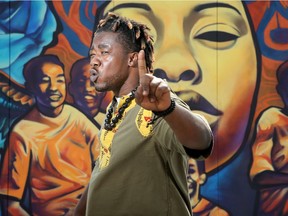 OTTAWA - SEPT. 16, 2020 -  Afro-Canadian poet/rapper Wise Atangana in front of the "We Gon' Be Alright" mural at Lisgar and Bank Street Wednesday.