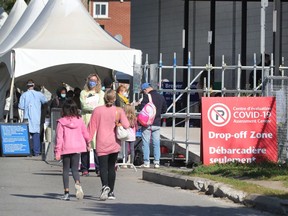 People arriving at the COVID-19 testing facility at Brewer Arena
