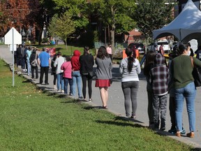 People line up at the COVID-19 testing facility at Brewer Arena on Wednesday Sept 23, 2020.