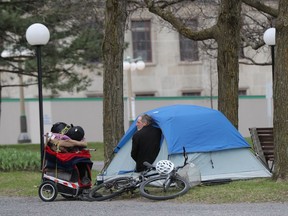 Homeless man set up in a tent next to the property beside the Supreme Court of Canada in Ottawa Friday May 8, 2020.