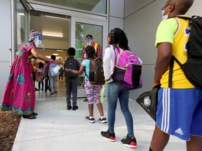 File photo/ Teachers and students outside École Horizon-Jeunesse in Ottawa Thursday Sept 3, 2020.