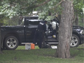 File photo/ A police examine a pickup truck inside the grounds of Rideau Hall in Ottawa on Thursday, July 2, 2020. Corey Hurren is accused of ramming his truck through a gate at the Governor General's official residence while heavily armed and threatening the prime minister.