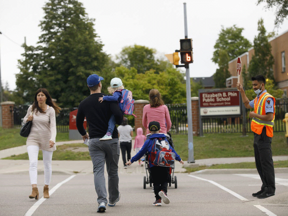  parents and kids going to school.