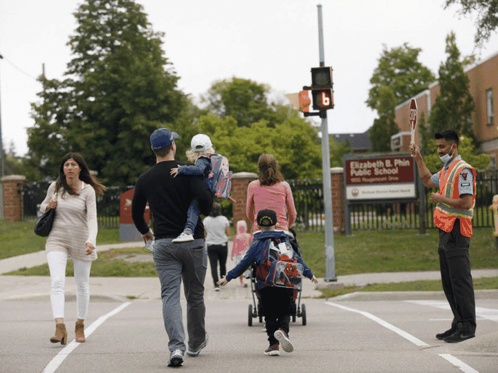  Parents and kids going to school.