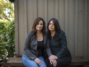 Kristy Kokoski, left, and Louise Frame, pose for a photograph near their home in Hamilton, Ont., on Sunday, September 27, 2020. Seven Canadian families are suing an Ontario sperm bank, alleging they were misled about their donor's background, including a potentially debilitating genetic condition.