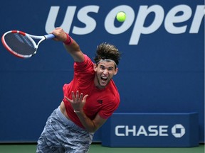 Dominic Thiem of Austria serves the ball against Felix Auger-Aliassime of Canada on day eight of the 2020 U.S. Open tennis tournament at USTA Billie Jean King National Tennis Center.