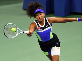 Naomi Osaka of Japan hits the ball against Shelby Rogers of the United States in the women's singles quarter-finals match on day nine of the 2020 U.S. Open tennis tournament at USTA Billie Jean King National Tennis Center.