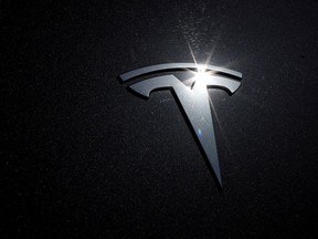 The Tesla logo on a car.