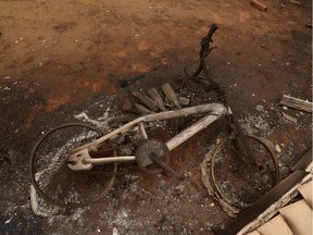 The remains of a fire charred bicycle are seen in the yard of a home destroyed by fire in the Cascade mountain range during the aftermath of the Riverside Fire near Molalla, Oregon, U.S., September 16, 2020.