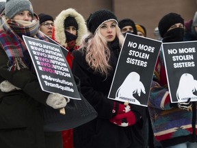 People take part in an event called WE MARCH AGAIN at Place Émilie-Gamelin in Montreal on Jan. 19, 2019. Organizers said the event was held in solidarity with women and human rights groups from across the world.