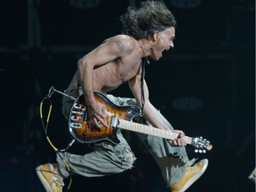 Files: Eddie Van Halen jumps during the opening number "JUMP" at the Rexall Place in Edmonton in 2004
