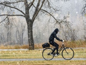 A cyclist rides in some not-so-great weather.