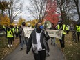 Ifrah Yusuf, incoming chair of the Justice for Abdirahman Coalition, leads the march from its starting point at McNabb Park on Saturday.