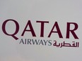 A sign marks directions to the check-in for Qatar Airway on March 21, 2017 at John F. Kennedy International Airport in New York.