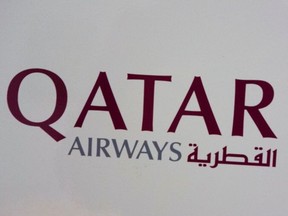 A sign marks directions to the check-in for Qatar Airway on March 21, 2017 at John F. Kennedy International Airport in New York.
