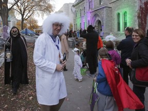 Mayor Jim Watson greets trick-or-treaters at City Hall in 2019. The mayor won't be handing out candies or holding Halloween events this year.