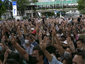 Protesters hold up the three finger salute during a rally October 15, 2020 in Bangkok, Thailand. Thousands of anti-government protesters and students held a demonstration at the Ratchaprasong Intersection in central Bangkok, marking the latest in a string of anti-government protests that began in late July with students and protesters calling for government reform.