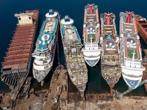In this aerial view from a drone, five luxury cruise ships are seen being broken down for scrap metal at the Aliaga ship recycling port on October 02, 2020 in Izmir, Turkey.