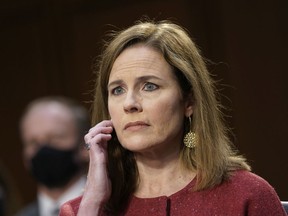Files: Supreme Court nominee Judge Amy Coney Barrett attends the second day of her Senate Judiciary committee confirmation hearing on Capitol Hill on October 13, 2020 in Washington, DC.