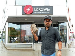 OTTAWA- October 13, 2020 --Aditya Budhiraja holds the stone that was used to break the glass door at Les Moulins La Fayette bakery in Ottawa, October 13, 2020.