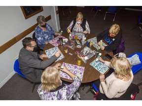 Friends and family play radio bingo at the Renfrew branch of the Royal Canadian Air Force Association. Valley Heritage Radio, which broadcasts it, estimates that participation in the weekly bingo has grown by between 25 and 50 per cent since the beginning of the pandemic.