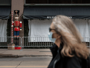 Christmas decorations being set up outside of Hudson’s Bay flagship store in Toronto on Oct. 29. The current COVID outlook doesn’t promise a huge number of good times ahead.