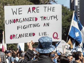 Peaceful anti-mask demonstrators in Montreal on Sept. 12 included QAnon supporters.