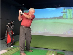 V!VA Barrhaven community member Ted Fenwick uses the retirement community’s golf simulator throughout the year to stay in shape for golf season.