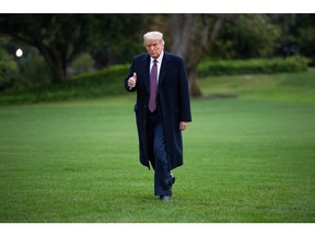 US President Donald Trump walks from Marine One after arriving on the South Lawn of the White House Oct. 1. Now he has to quarantine, along with Melania Trump, who also tested positive, for 14 days.