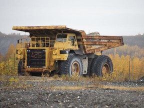 A mining truck is parked on the site of the closed Jeffrey asbestos mine as residents vote for a new town name in Asbestos, Quebec, Canada, on Friday, Oct. 16, 2020. The town used geography, history and a touch of poetry to offer new name options to its residents as they vote to abandon a name associated with cancer in English.