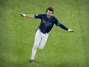 Tampa Bay Rays right fielder Brett Phillips celebrates after driving in the winning run against the Los Angeles Dodgers during the ninth inning of game four of the 2020 World Series at Globe Life Field.