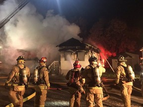 Firefighters battle a mobile home fire at 8 Redfern Ave. in Bells Corners on Tuesday, Oct. 27, 2020.
