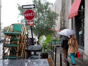 FILE PHOTO: Chairs are stacked outside a bistro as the Quebec government has ordered all restaurants, bars and casinos to close for 28 days effective midnight September 30 as coronavirus disease (COVID-19) numbers continue to rise in Montreal, Quebec, Canada September 29, 2020. REUTERS/Christinne Muschi/File Photo/File Photo ORG XMIT: FW1