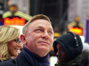 FILE PHOTO: Actor Daniel Craig reacts during a promotional appearance on TV in Times Square for the new James Bond movie "No Time to Die"  in Manhattan, December 4, 2019.