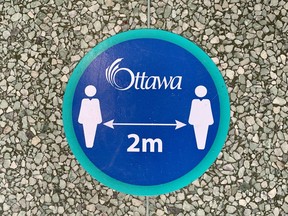 OTTAWA -- Social distancing sign on the floor at Ottawa City Hall.  Thursday, Oct. 1, 2020.
