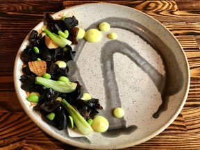 A signature dish at Carben Food + Drink is smoked wood eat mushrooms with miso glaze, turmeric aioli, bok choy and edamame