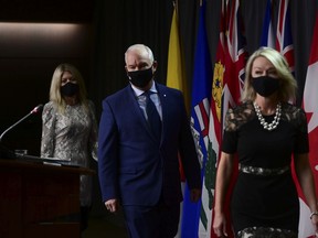 Conservative member of Parliament Michelle Rempel Garner, left to right, Conservative Leader Erin O'Toole and Conservative Deputy Leader Candice Bergen arrive to hold a press conference in Ottawa on Thursday, Oct. 22, 2020.