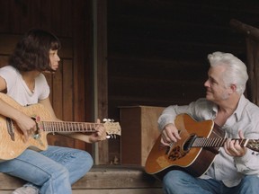 Two guitars, four hands: Eva Noblezada and Dale Watson in Yellow Rose.