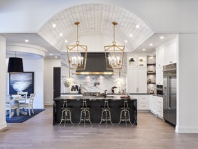Astro Design Centre won for a stunning custom kitchen with barrel-vaulted ceiling and oversized pendant lights.