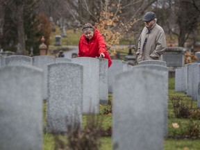 Patty and Russ Paquette visited Beechwood Cemetery, where their fathers are buried, on Remembrance Day.