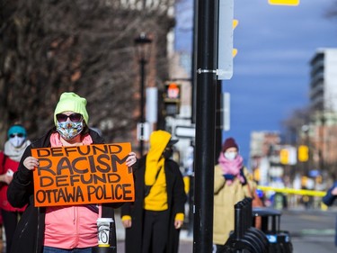 Protesters for Indigenous and Black rights rallied outside Ottawa police headquarters on Elgin Street, Saturday, Nov. 21, 2020, where they demanded the release of 12 people arrested early Saturday morning, after another protest was shut down.
