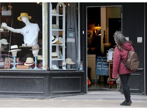 A woman looks inside a haberdashery in the Glebe, one of Ottawa's traditional '15-minute neighbourhoods.'