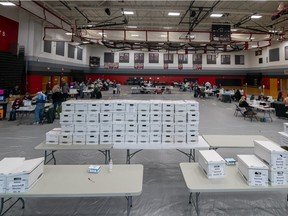 MADISON, WI - NOVEMBER 03: Boxes with absentee ballots wait to be tabulated in the gym at Sun Prairie High School on November 3, 2020 in Sun Prairie, Wisconsin.