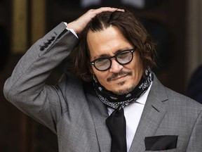 FILE PHOTO: Johnny Depp loses his libel case against the Sun newspaper LONDON, ENGLAND - JULY 13: Actor Johnny Depp arrives at the Royal Courts of Justice, Strand on July 13, 2020 in London, England. American actor Johnny Depp is taking News Group Newspapers, publishers of The Sun, to court over allegations that he was violent towards his ex-wife, Amber Heard, 34.