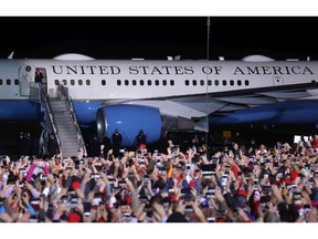 U.S. President Donald Trump greets supporters as he walks off of Air Force One during a campaign rally at Richard B. Russell Airport on Nov. 01, 2020 in Rome, Georgia. He intends to change the plane's paint job.